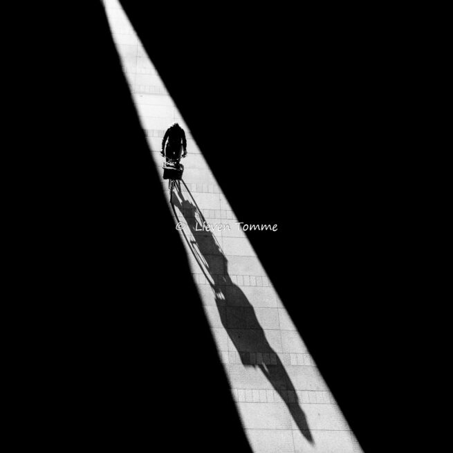 Cyclist in a ray of light